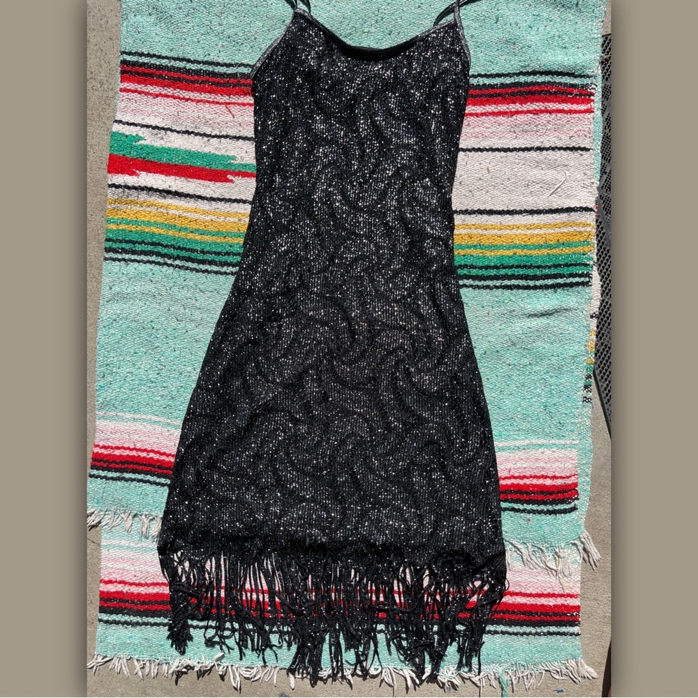 Black sparkly dress with fringe
Gatsby, 20’s vibe, very sparkly with lining